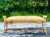 Enhance your coastal retreat with this Vintage Coastal Woven Rattan Bench. The expertly woven rattan frame exudes a...