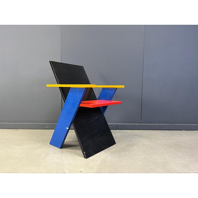 Unique postmodern coloured wooden armchair in the style of gerrit Rietveld. This chair has an unknown provenance but...