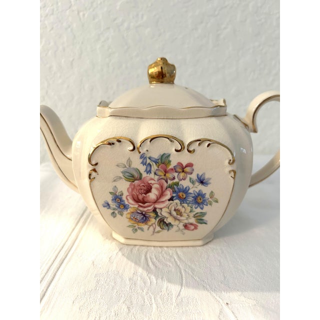 Lovely nicely matched vintage tea set features one 1960s Sadler English off-white lidded teapot with crown finial and...