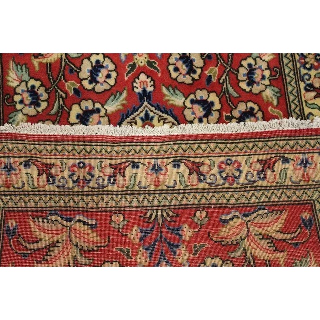 This is a vintage Persian Saruk rug from the 1950s. This one of a kind rug is hand-knotted by skilled weavers using all...