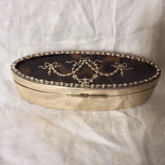 Hard to find sterling silver with pique work. This has some worn area on the bottom, some dings and the hinged top doesn't...