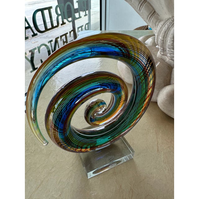 Lovely vintage colorful rainbow glass art sculpture mounted on lucite. Marked Murano. No chips or breaks. Dimensions 8 H x...