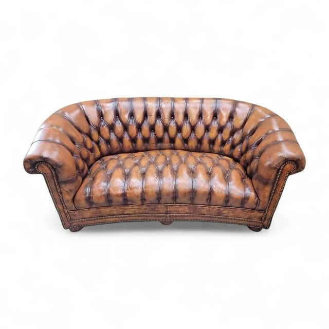 Vintage English Tufted Hand Dyed Distressed Cognac Leather Chesterfield Sofa - Pair This exceptional pair of vintage...