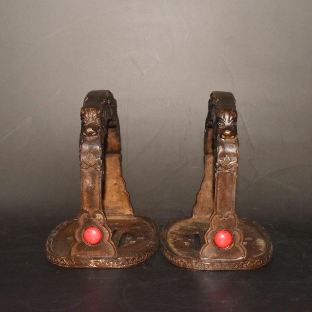 This is a matched pair of antique bronze stirrups, traditionally used for horseback riding and often collected as...