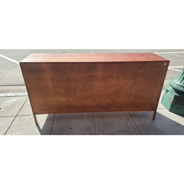 A very beautiful long dresser walnut produced by Calvin Furniture Company and designed by Master Paul McCobb. This is the...