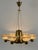 Extremely rare, lovely and highly decorative mid-century modern six-armed and seven flamed. Brass chandelier. Designed by...