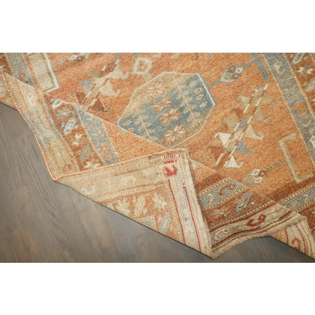 an early 20th-century Tribal Northwest Persian Runner in apricot tones Details rug no. j4245 size 3' 8" x 12' 5" (112 x...