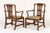 A handsome pair of late 18th century english mahogany armchairs of unusually generous proportions, each with a shaped...