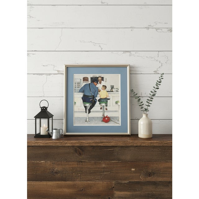 This is a professionally framed print of the famous Norman Rockwell painting "The Runaway". The original oil on canvas...