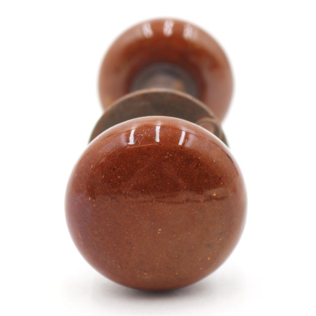 Vintage reddish brown ceramic passage door knobs paired with one cast iron rosette. The original mounting screws are not...