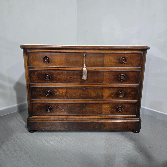 Very good large French walnut commode chest of four oak lined drawers, one being a secrect drawer in the skirt, walnut cup...