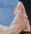 This oil on panel artwork depicts a reclining male figure, exuding a serene confidence against a striking backdrop of a...