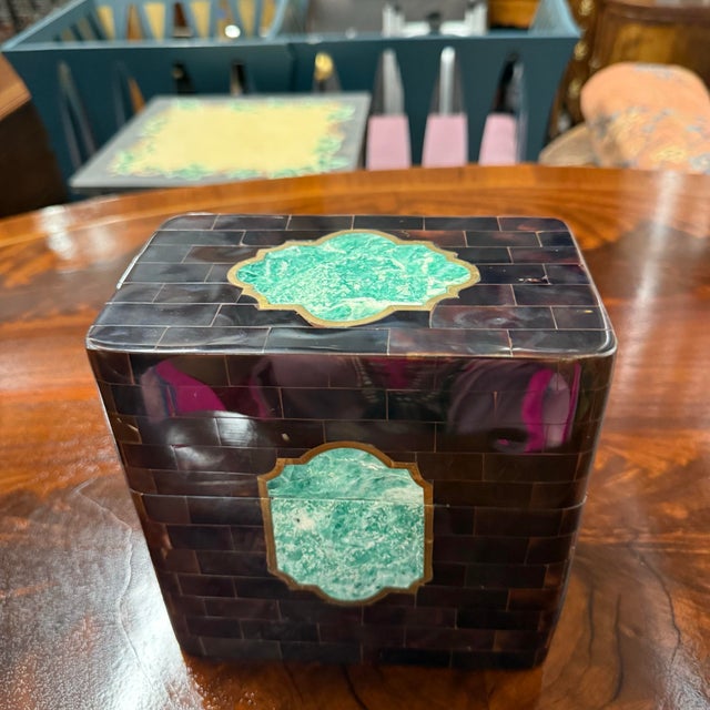 A flat-lidded brown polished horn box attributed to Maitland Smith, with two beautifully inlaid and brass trimmed polished...