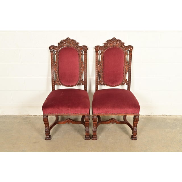 An exceptional pair of antique Victorian or Renaissance Revival side chairs or dining chairs In the manner of R.J. Horner...