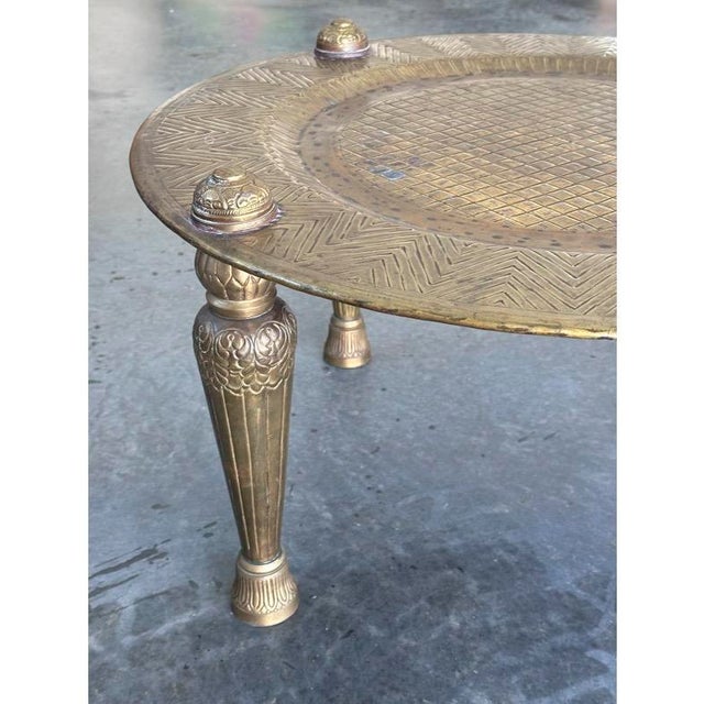 This object is a handcrafted brass multi-purpose stand, also known by traditional names such as a Mukali or Bajot. These...
