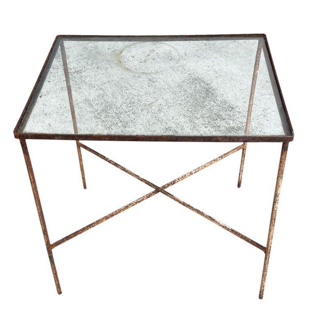 A rustic early American iron and glass accent table. This table was taken from the estate of an Oklahoma oilman in Tulsa...