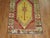 A mid-20th century geometric Turkish runner featuring bright colors with one medallion in an electric blue color. The...