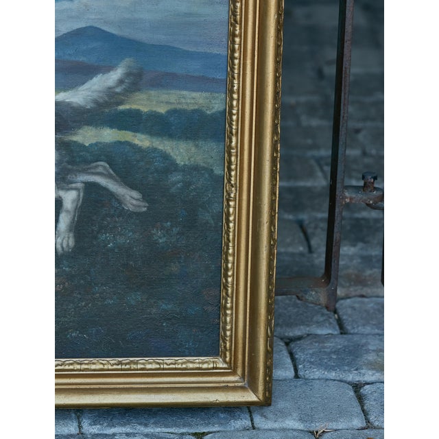 An English oil on canvas hunting dog painting from the late 18th century in carved giltwood frame. Elevate your art...