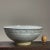 Vintage Minimalist Footed Shino Glazed Stoneware Bowl. Grayish white shino glazed stoneware bowl with unglazed footing. In...