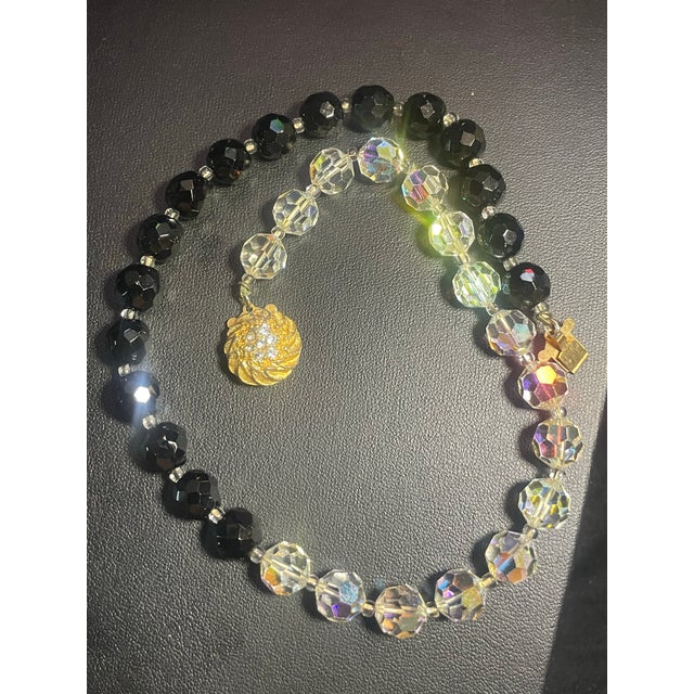 In the style of Vendome, 1950 MCM half-and-half strand combines black glass (or Jet-style glass) and clear lead crystal...