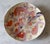 Colorful handmade ceramic art pottery bowl featuring an abstract swirl and graffiti-style pastel pattern, textured edge...