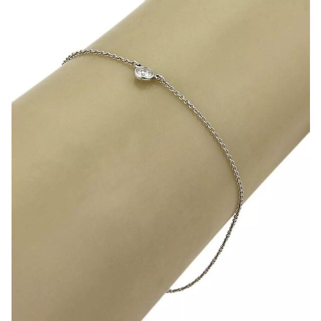 This lovely authentic bracelet is from Tiffany & Co. by designer Elsa Peretti from her BY THE YARD collection, it is...