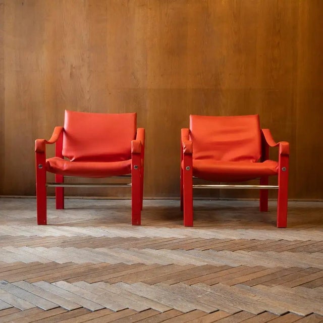 A rare set of safari lounge chairs by Maurice Burke, manufactured by Arkana in the United Kingdom. The chairs feature...