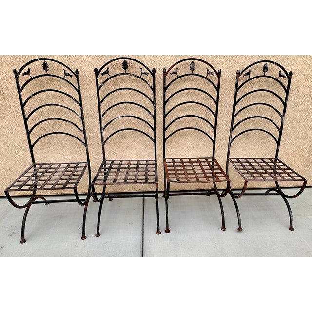 Elevate your outdoor space with this charming set of four antique French Provincial wrought iron chairs dates from around...