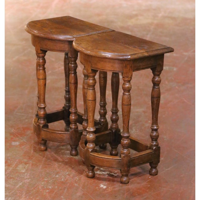 Early 20th Century French Louis XIII revival side tables, crafted in France circa 1920 and inspired by the robust...