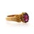Vintage rodolite garnet solitaire ring in 18K yellow gold featuring oval faceted rodolite garnet in ornate eight-prong...