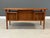 A mid century modern teak floating top desk designed by Peter Lovig Nielsen with a beautifully sculpted lip back edge....