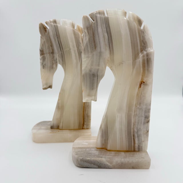 There is something enduring about carved stone — especially when it takes the form of a horse. This pair of vintage banded...