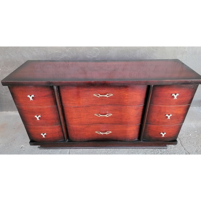 Quality materials and craftsmanship in this "Cordovan Brown" finish 1950's low dresser. Original finish and hardware....