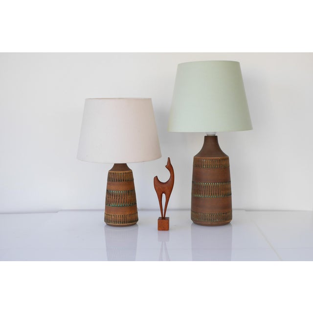 A fantastic pair of matching vintage ceramic lamps, handmade by thomas anagrius for kvidinge keramik, sweden. These lamps...