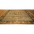 "This is a large antique Chinese wool carpet, circa 1900, measuring approximately 12 by 15 feet. It features a hand-...