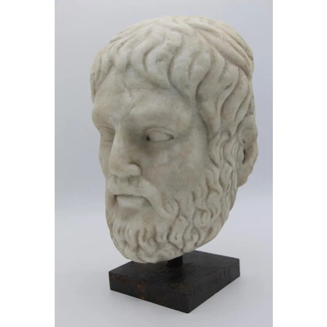 18th-century or older sculpted marble head mounted on a contemporary iron base in good condition
