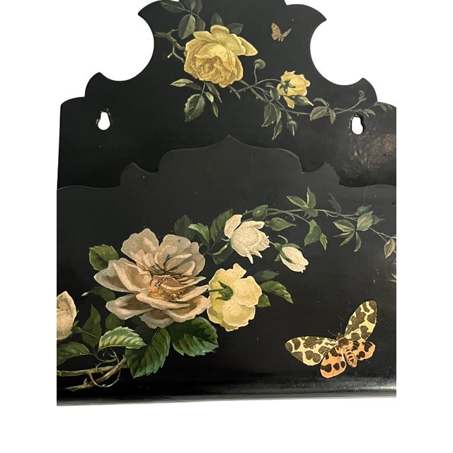 A charming late 19th-century Chinoiserie papier mache wall pocket featuring a beautifully hand-painted floral design on a...