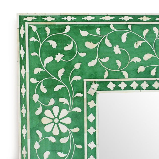Vintage Indian mirror with delicate floral designs and fresh green resin background. Beautiful attention to hand cut and...
