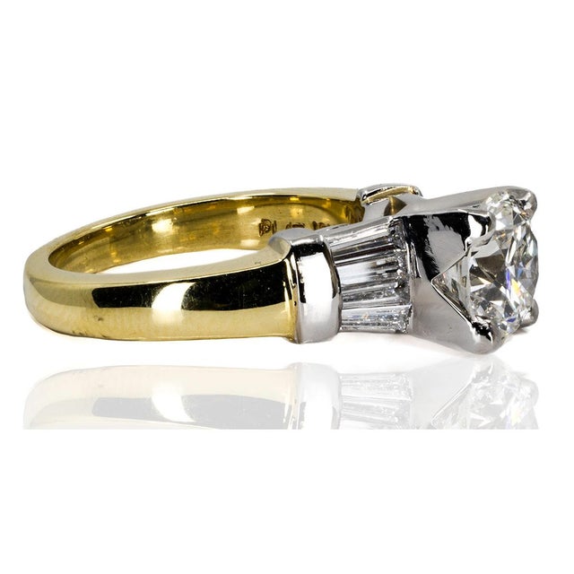 18k & Platinum Ring with GIA certified (#2225071615) H color VS2 clarity 2.22 carat round brilliant and 8 tapered bagutte...