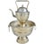Add a touch of sophistication and a timeless vibe with this remarkable one-of-a-kind antique Moroccan kettle and wash...