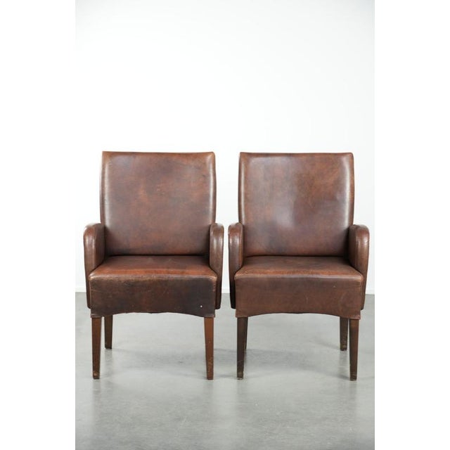 Set of 6 beautifully finished dining chairs/occasional chairs with armrests made of cowhide leather. : This lovely and...