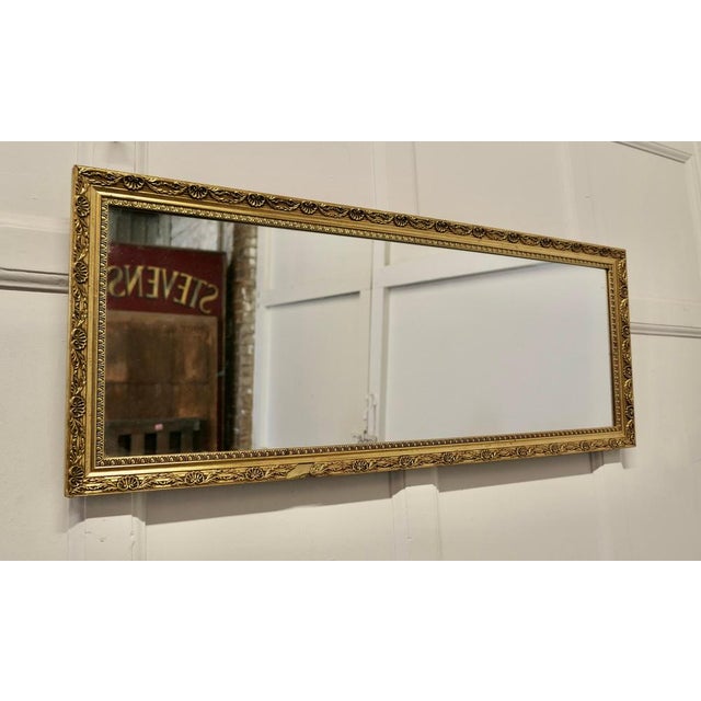 Gilt Frame Long Wall Mirror. This is a charming and elegant piece, it is unusually long and landscape the bright Gilt...