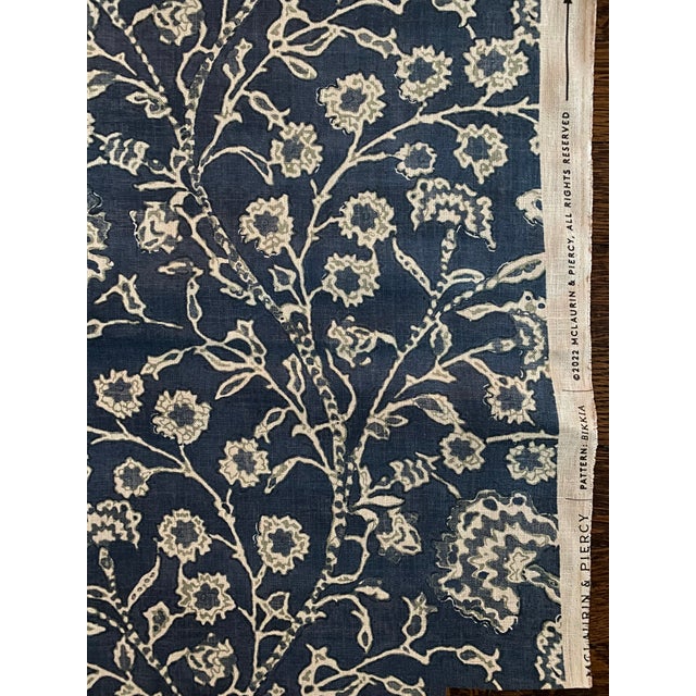 Trailing floral fabric in rich tones of indigo and sea blue. Found along the cliffs of the Pacific Islands of Maluku, the...