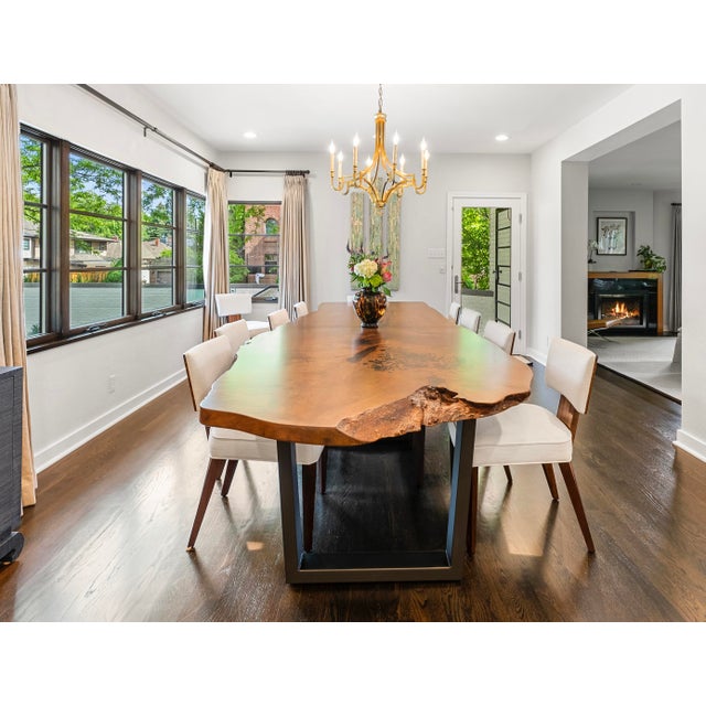 An extraordinary 12-foot custom live-edge maple dining table handcrafted by CS Woods of Denver, one of the premier...