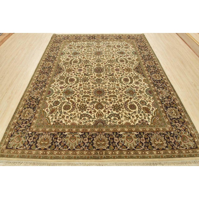 This fine traditional Agra rug is hand-knotted with an all-wool pile on a cotton foundation. This rug is new and in...