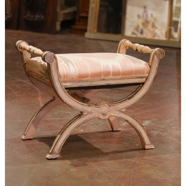 This mid-century Italian curule-form stool, crafted circa 1960, features a gracefully arched X-base construction with...