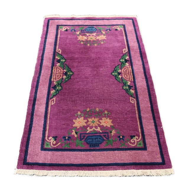 Discover the allure of a bygone era with this remarkable vintage hand-knotted Chinese Art Deco rug, expertly crafted in...