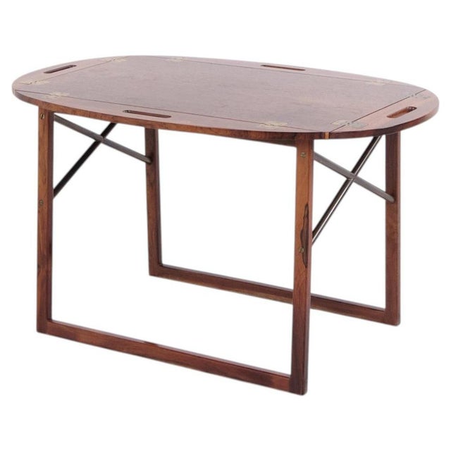 Rosewood butler table designed by svend langkilde in the 1960s. Danish design with removable tray and folding base. —...