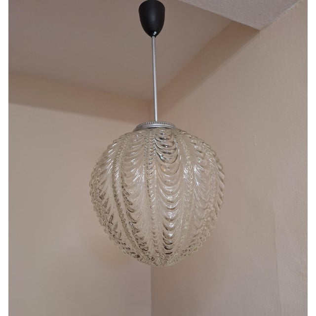 Vintage Ceiling Lamp with a Spherical Relief Glass Shade on a Chrome-Plated Metal Mount, 1970s, in Very Good conditions....