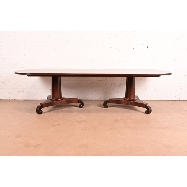 An exceptional Empire, Regency, or Neoclassical style double pedestal dining table In the manner of John Widdicomb USA,...